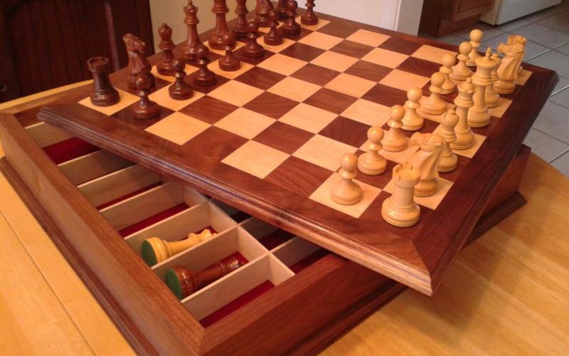 Contrasting maple and black walnut with compartment for chessmen storage