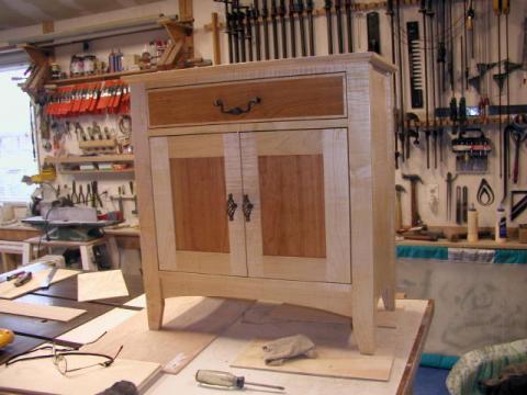Tiger Maple With Cherry Cabinet in workshop