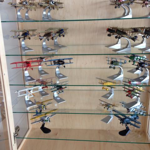 Adjustable glass shelves in the model aircraft display case