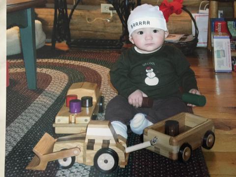 Child playing with toy trucks