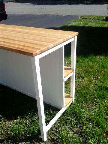 Wainscoating on the butcher block kitchen island to match the kitchen walls